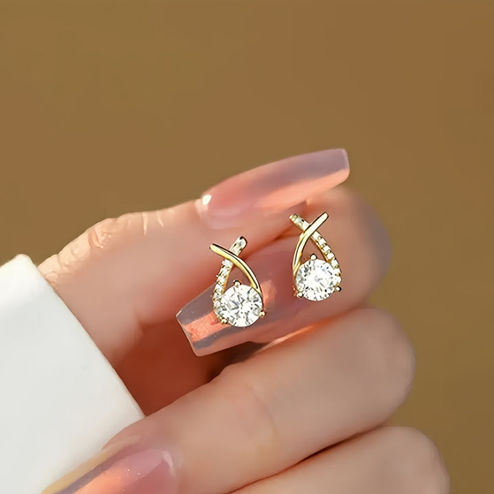 Oorbellen met gouden kruis en zirkonia