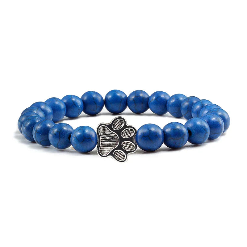 Armband met pootafdrukken versierd met kralen