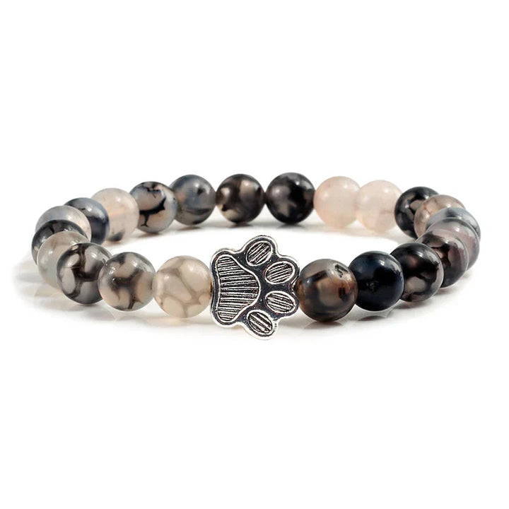 Armband met pootafdrukken versierd met kralen