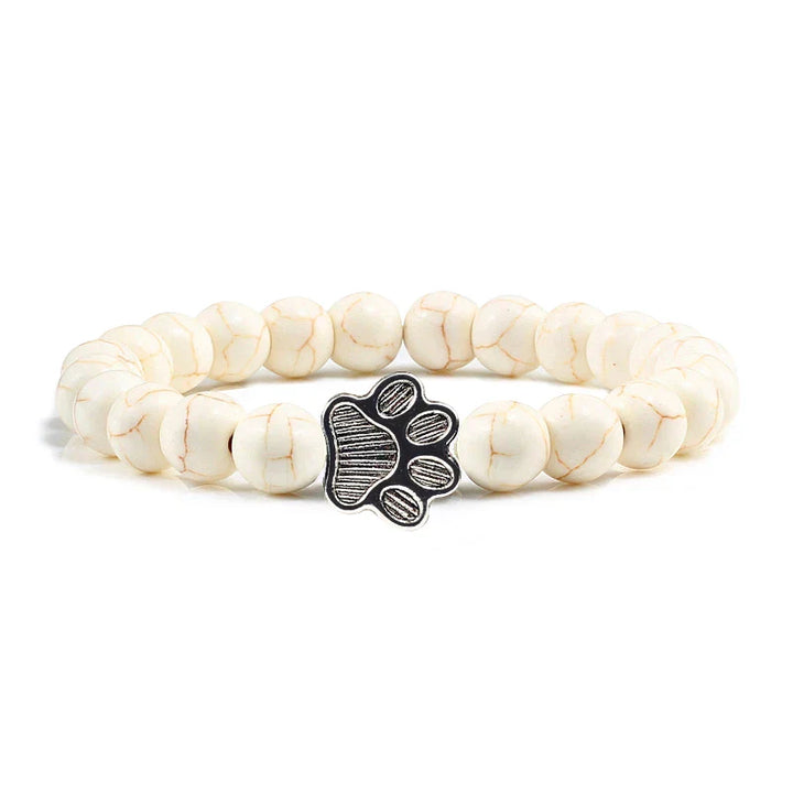 Armband met pootafdrukken versierd met kralen