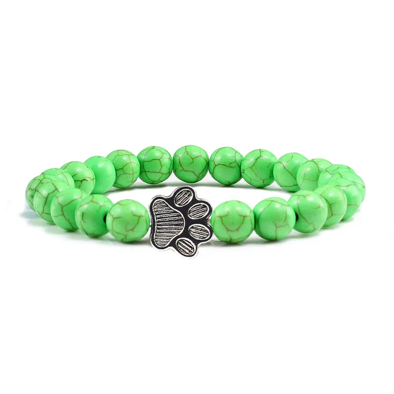 Armband met pootafdrukken versierd met kralen