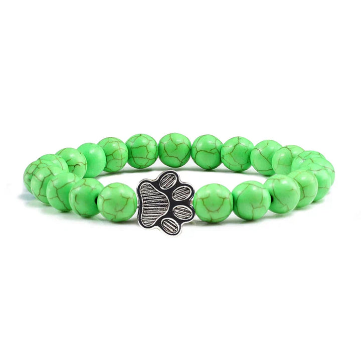 Armband met pootafdrukken versierd met kralen