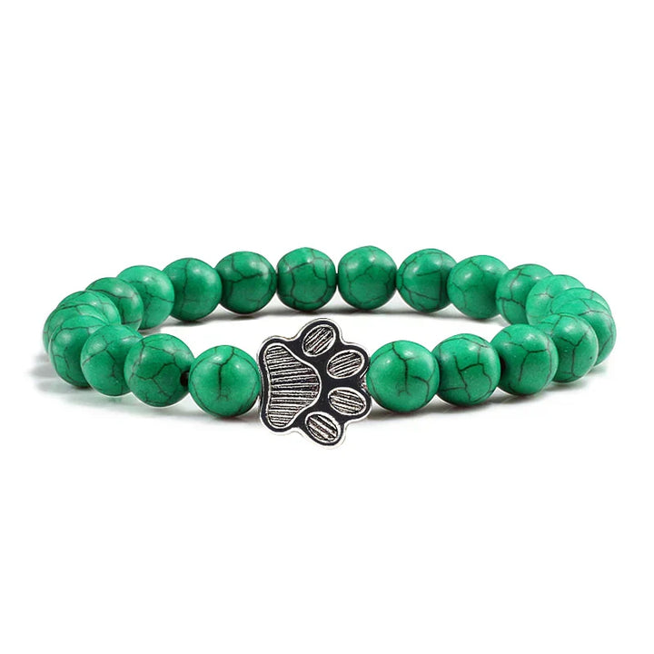 Armband met pootafdrukken versierd met kralen