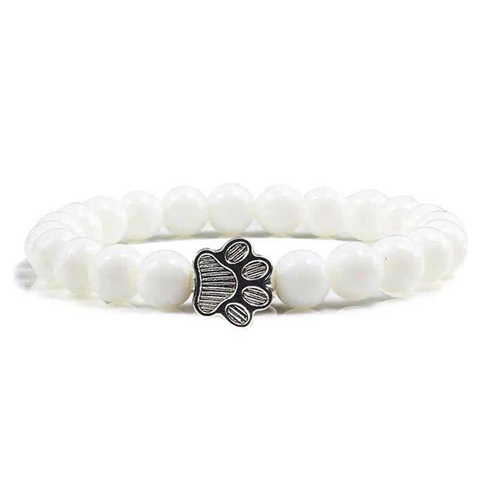 Armband met pootafdrukken versierd met kralen
