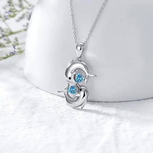 Zilveren Halsketting met Dubbele Dolfijnen en Blauwe Kristal