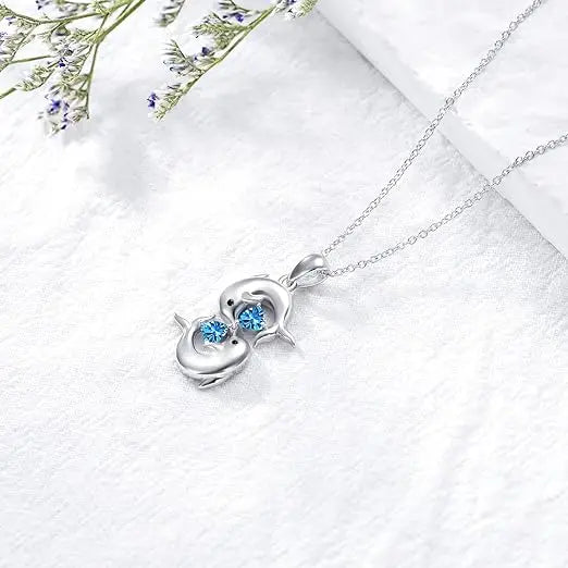 Zilveren Halsketting met Dubbele Dolfijnen en Blauwe Kristal