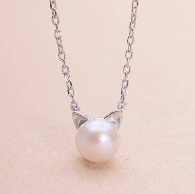 Prachtige katten- en parelketting met gratis oorbellen en ring